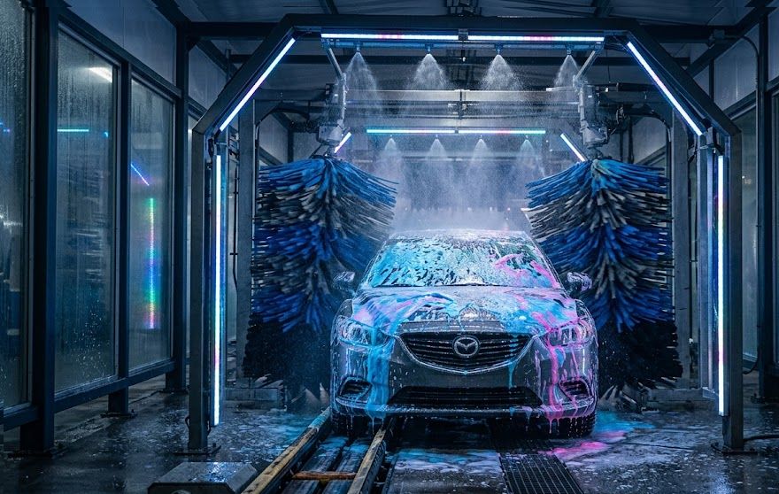Express car wash tunnel with modern equipment purchased through car wash financing.