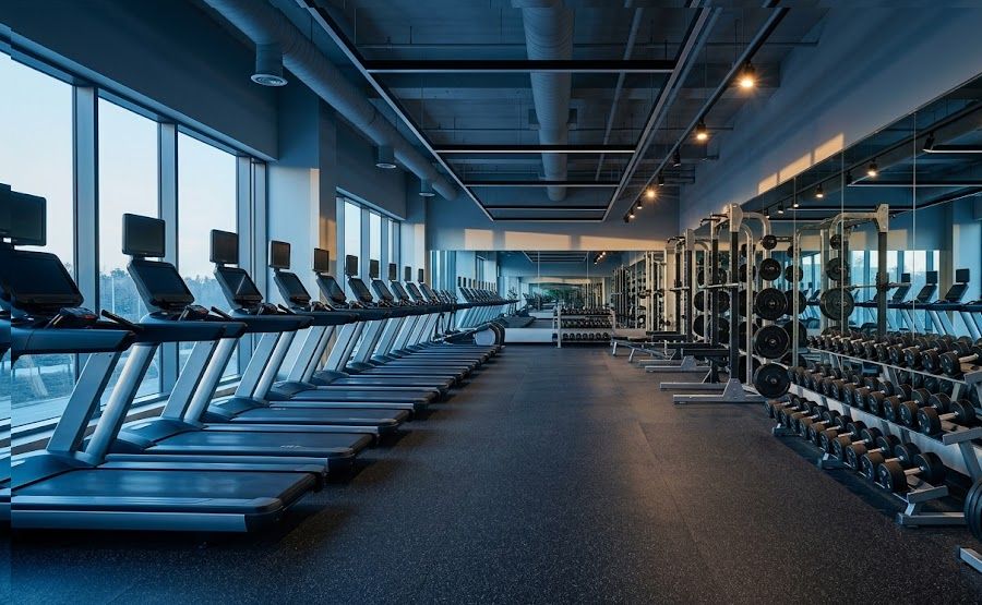 Modern gym floor with new equipment funded by gym business loans.