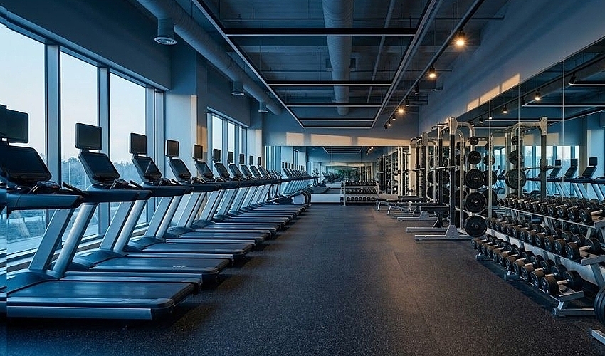Modern gym floor with new equipment funded by gym business loans.